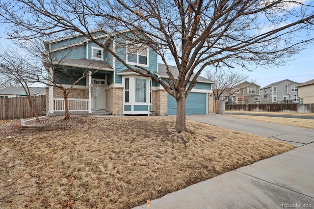 view of front of property with fence, a residential view, concrete driveway, an attached garage, and brick siding