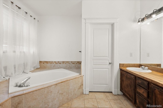 full bath with tile patterned flooring, a bath, and vanity