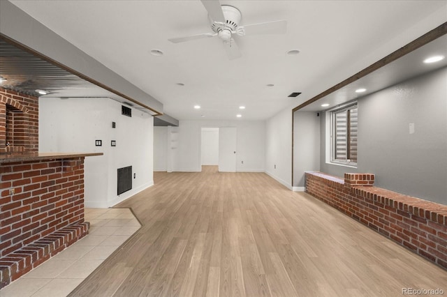 living room with visible vents, recessed lighting, baseboards, and wood finished floors