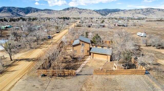 drone / aerial view featuring a rural view and a mountain view