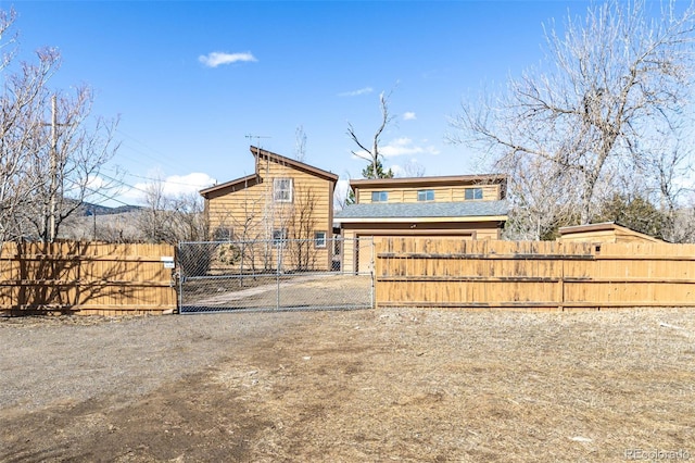 view of front of home featuring a fenced front yard and a gate