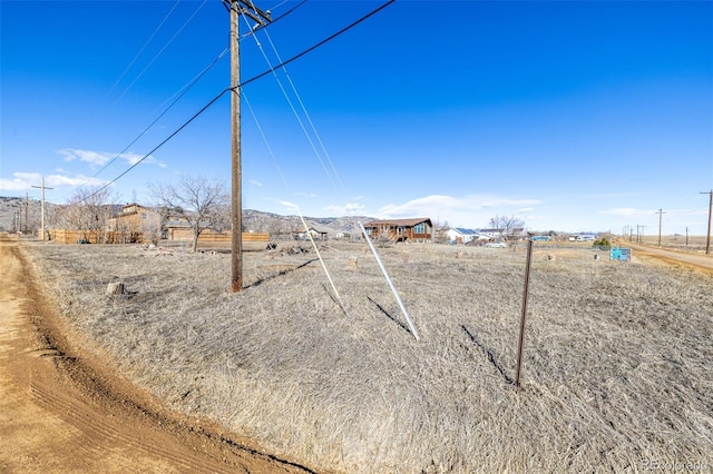 view of yard with a rural view