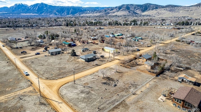 birds eye view of property featuring a mountain view