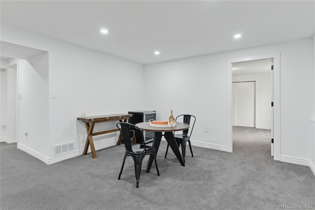 view of carpeted dining area