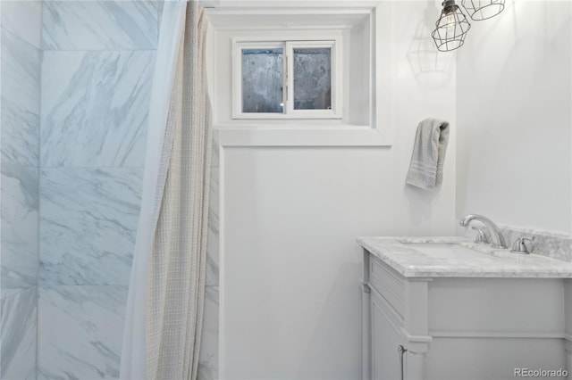 bathroom with vanity and walk in shower