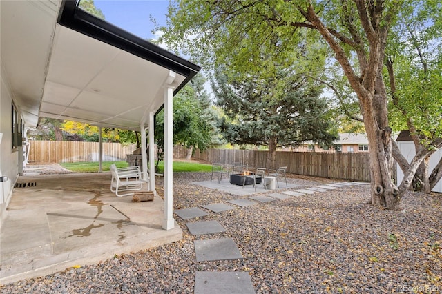 view of yard with a patio and a fire pit