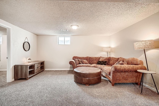 living room featuring carpet flooring and a textured ceiling