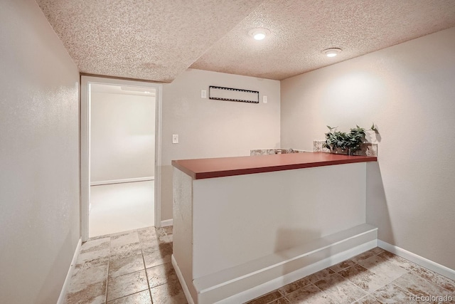 interior space with a textured ceiling