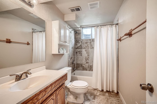 full bathroom with shower / bathtub combination with curtain, vanity, a textured ceiling, and toilet