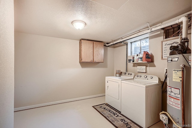 laundry area with water heater, cabinets, a textured ceiling, and independent washer and dryer