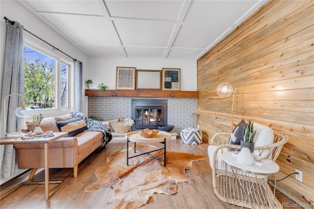 505 S Roosevelt Rd, Lafayette, CO 80026 - living room with wood walls, hardwood / wood-style floors, coffered ceiling, and a brick fireplace