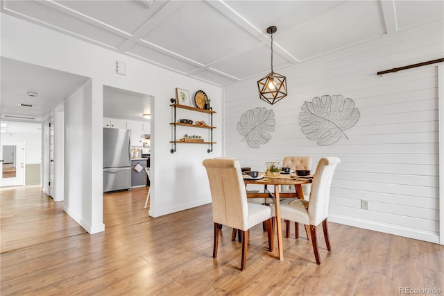505 S Roosevelt Rd, Lafayette, CO 80026 - dining area featuring baseboards, wood finished floors, and wood walls