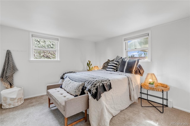 505 S Roosevelt Rd, Lafayette, CO 80026 - bedroom featuring a baseboard heating unit, carpet flooring, multiple windows, and baseboards