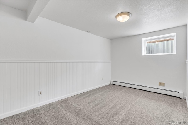 505 S Roosevelt Rd, Lafayette, CO 80026 - unfurnished room featuring a baseboard radiator, carpet, and a wainscoted wall