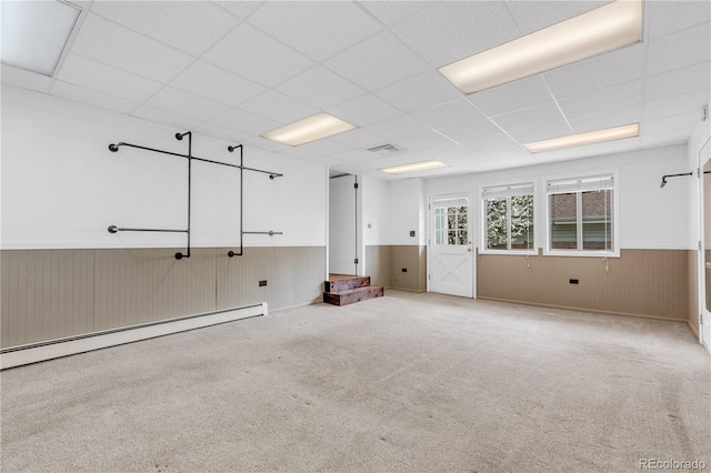 505 S Roosevelt Rd, Lafayette, CO 80026 - spare room with a baseboard radiator, wainscoting, a paneled ceiling, and carpet floors