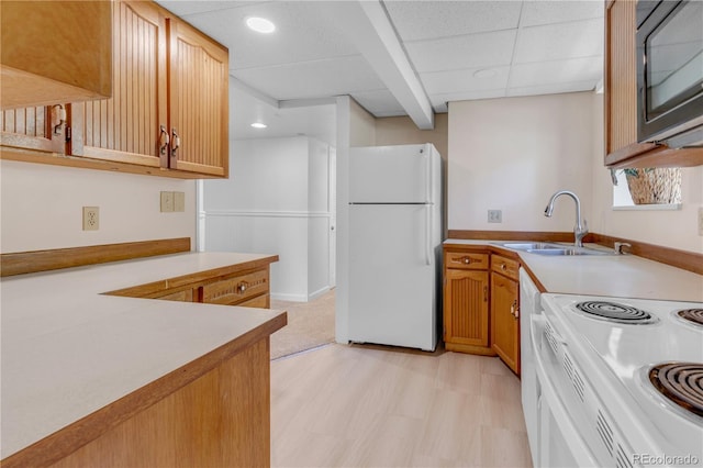505 S Roosevelt Rd, Lafayette, CO 80026 - kitchen with white appliances, recessed lighting, light countertops, a sink, and light floors
