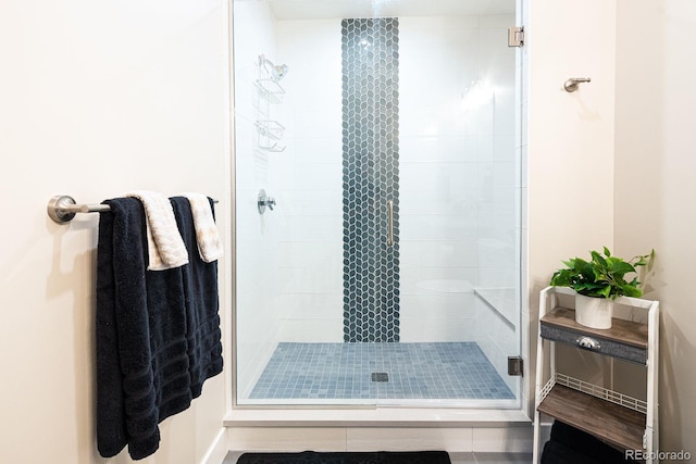 bathroom featuring tile patterned flooring and walk in shower