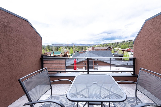 balcony featuring a mountain view