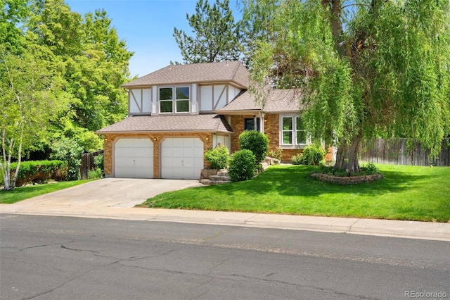 6544 Alkire Ct, Arvada, CO 80004 - view of front of home featuring concrete driveway, an attached garage, and brick siding