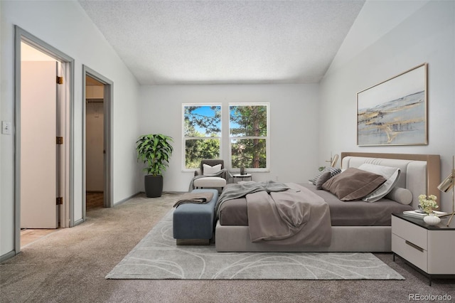 6544 Alkire Ct, Arvada, CO 80004 - bedroom with carpet, lofted ceiling, and a textured ceiling