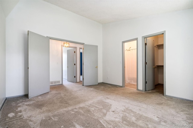 6544 Alkire Ct, Arvada, CO 80004 - unfurnished bedroom with carpet flooring, a walk in closet, and connected bathroom