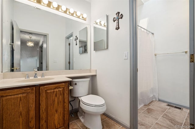 6544 Alkire Ct, Arvada, CO 80004 - bathroom with vanity, toilet, a shower with shower curtain, and tile patterned floors