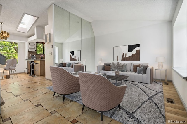 6544 Alkire Ct, Arvada, CO 80004 - living area with a skylight, a chandelier, and high vaulted ceiling