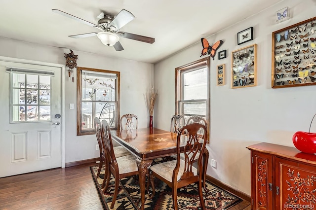 dining space with ceiling fan, baseboards, and wood finished floors