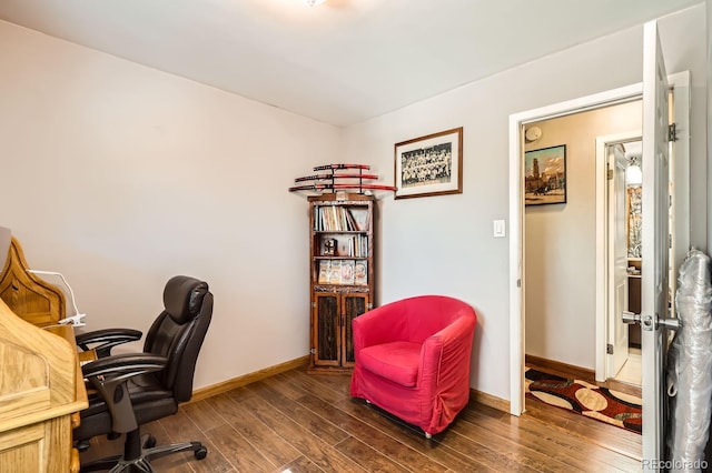 home office featuring wood finished floors and baseboards