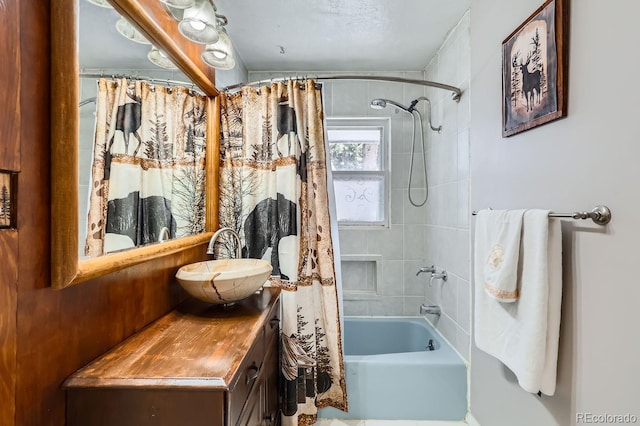 bathroom with shower / bath combo and vanity