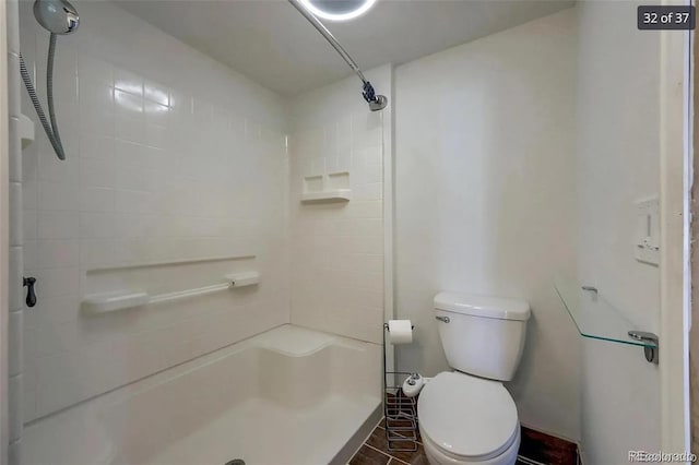 full bathroom featuring toilet and walk in shower