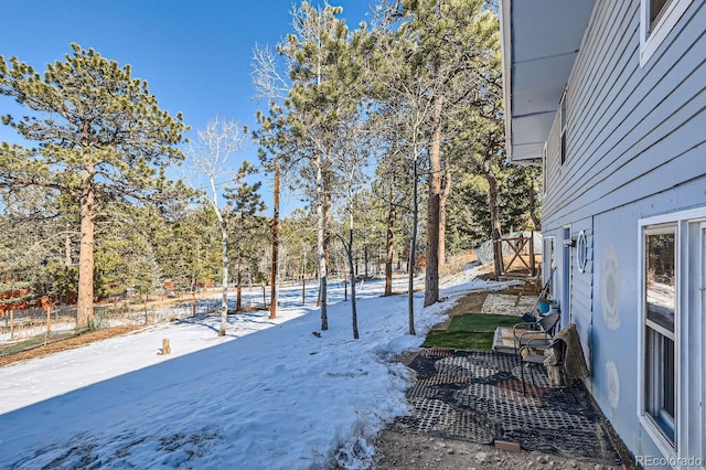 view of yard layered in snow