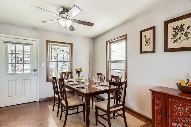 41 Yew Ln, Bailey, CO 80421 - dining area with baseboards, a ceiling fan, and wood finished floors