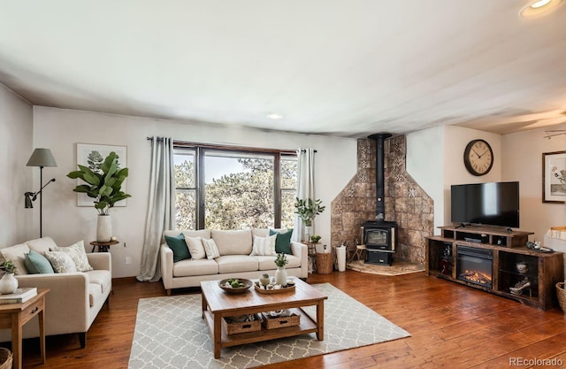 41 Yew Ln, Bailey, CO 80421 - living room with a wood stove, wood-type flooring, and recessed lighting