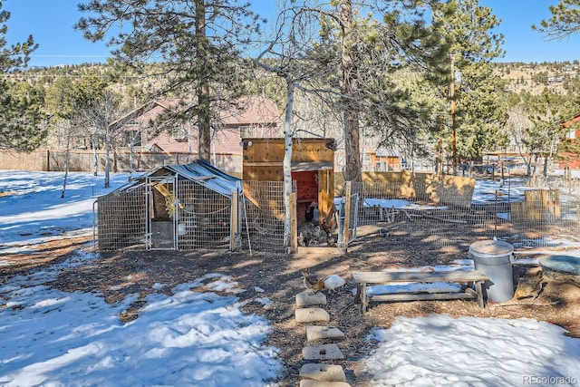41 Yew Ln, Bailey, CO 80421 - yard covered in snow with exterior structure and an outdoor structure