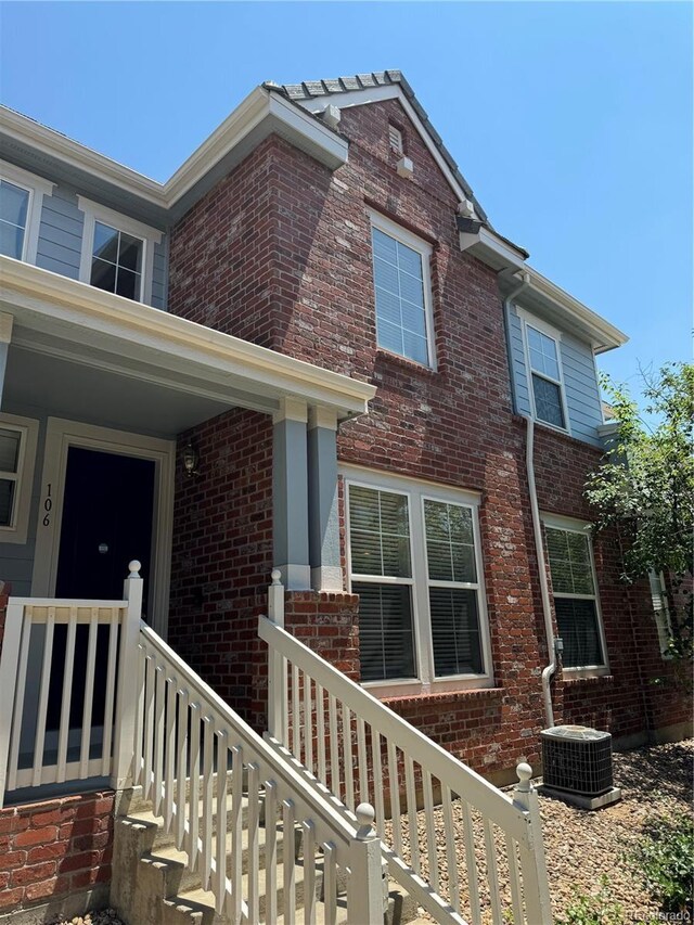 exterior space featuring a porch and central AC unit