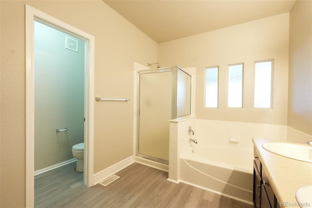 full bathroom with vanity, toilet, separate shower and tub, and hardwood / wood-style floors