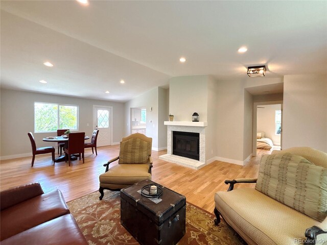 18073 E Belleview Pl, Centennial, CO 80015 - living room with light wood-style floors, recessed lighting, a fireplace, baseboards, and lofted ceiling