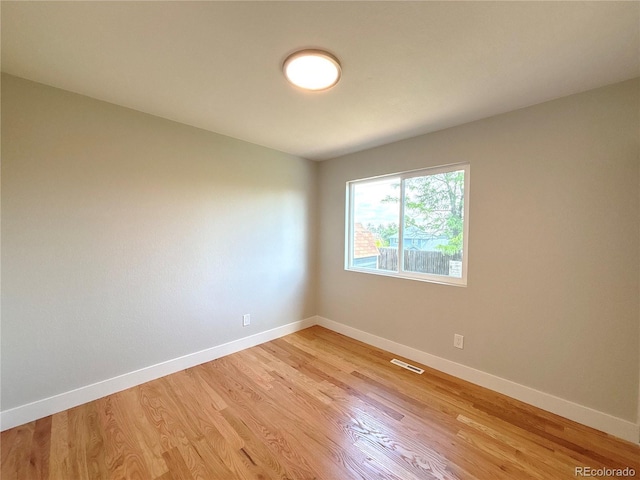 18073 E Belleview Pl, Centennial, CO 80015 - unfurnished room with light wood finished floors and baseboards