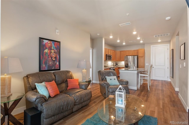 14341 E Tennessee Ave Unit 203, Aurora, CO 80012 - living room with light wood-type flooring and recessed lighting