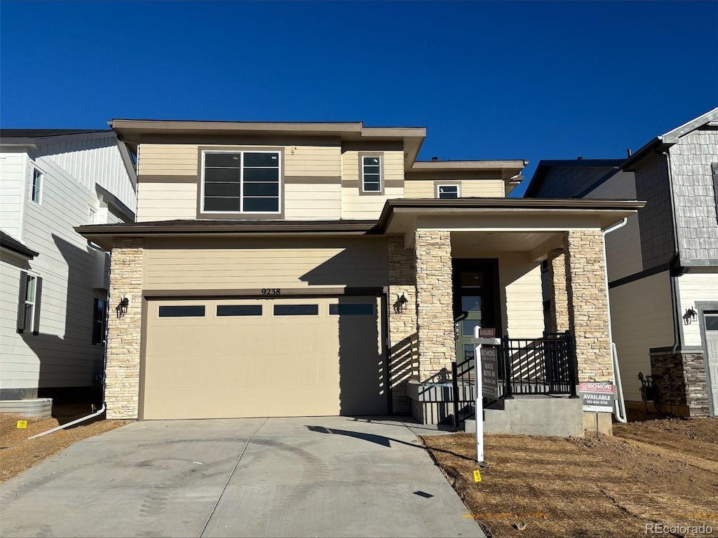 prairie-style home featuring a garage