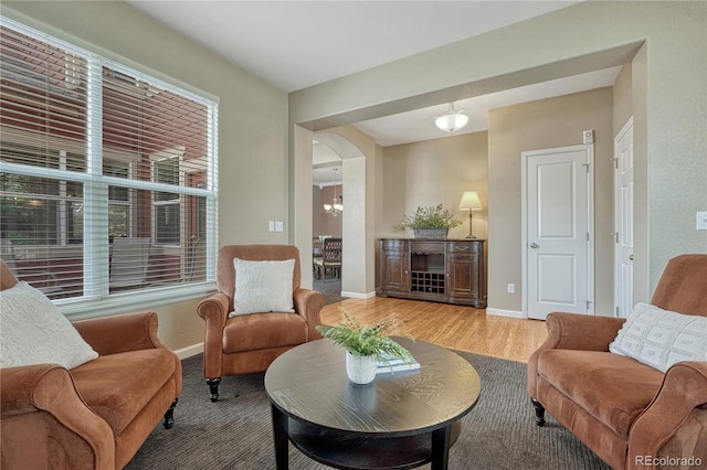 living room with wood finished floors and baseboards