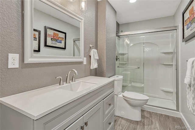 bathroom with a stall shower and a textured wall