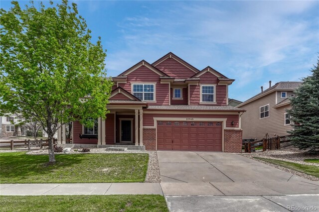 22965 Allendale Ave, Parker, CO 80138 - craftsman house featuring concrete driveway, an attached garage, and brick siding