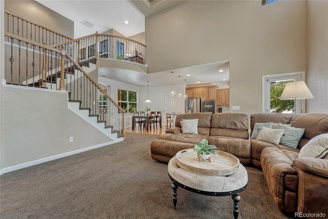 22965 Allendale Ave, Parker, CO 80138 - living area featuring stairway, carpet, a towering ceiling, recessed lighting, and a chandelier