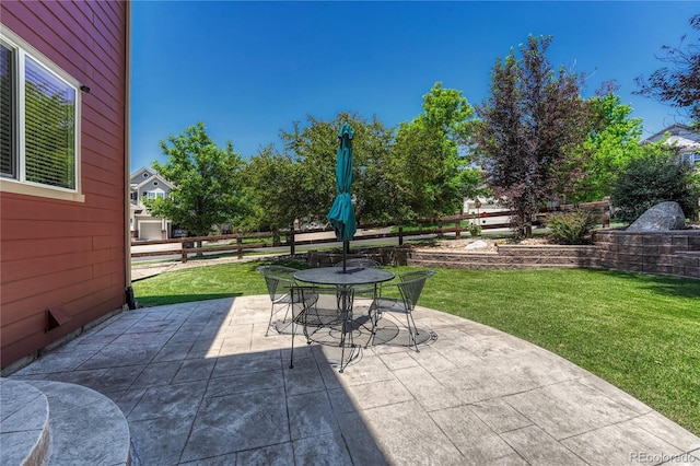22965 Allendale Ave, Parker, CO 80138 - fenced backyard featuring a patio and outdoor dining space