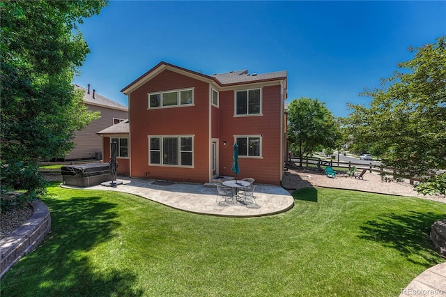 22965 Allendale Ave, Parker, CO 80138 - rear view of house featuring a hot tub, a patio, and a shingled roof