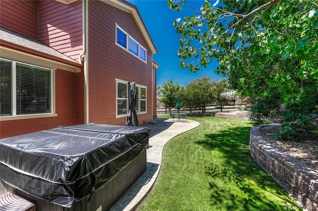 22965 Allendale Ave, Parker, CO 80138 - view of green lawn featuring a hot tub and a patio area