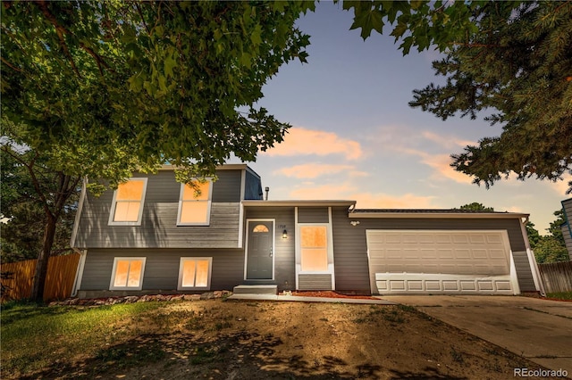 1705 Cathay Ct, Aurora, CO 80011 - split level home featuring a garage and driveway