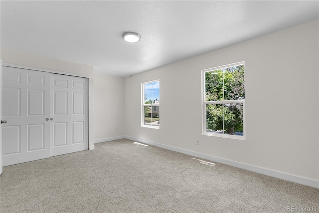 1705 Cathay Ct, Aurora, CO 80011 - unfurnished bedroom with carpet floors and a closet